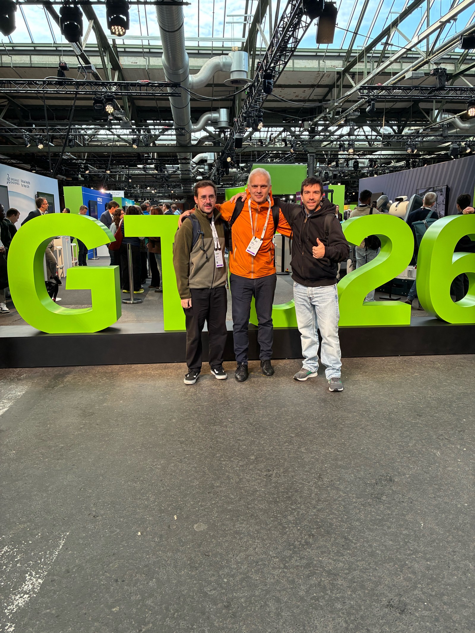 Filipe, Francisco, and Pedro in front of the GTC 26 sign in Berlin