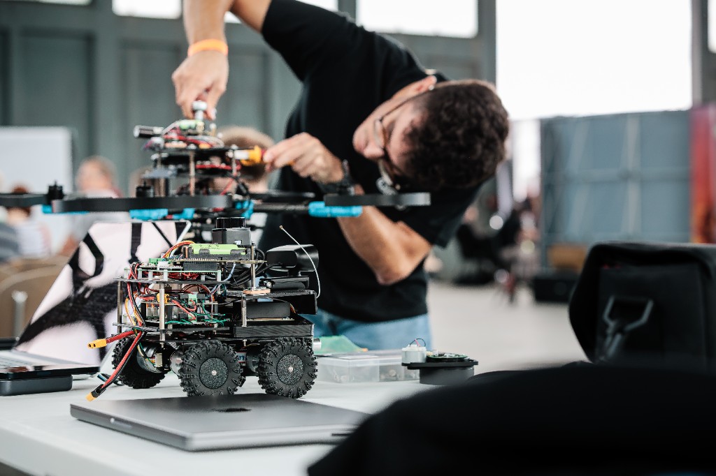 Francisco adjusting the UBR UAV on a table