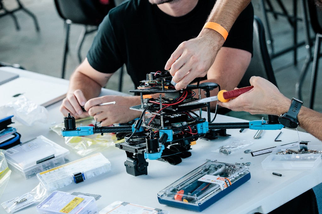 Hands assembling and tuning the UAV frame and avionics stack